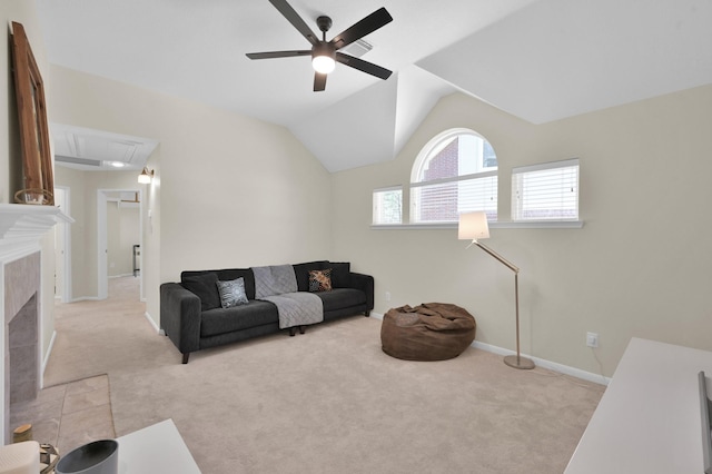 living room with baseboards, attic access, vaulted ceiling, light carpet, and a ceiling fan