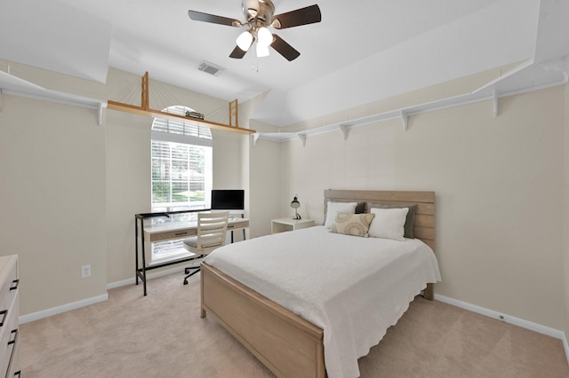 bedroom with visible vents, baseboards, light colored carpet, and a ceiling fan