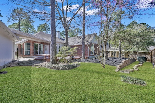 view of yard with fence and a wooden deck