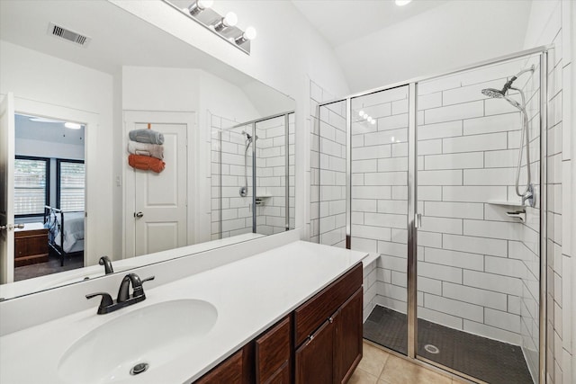 full bathroom featuring tile patterned floors, visible vents, ensuite bath, and a shower stall