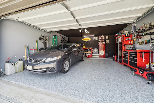 garage featuring a workshop area and a garage door opener