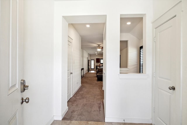 hall featuring recessed lighting, baseboards, and carpet flooring