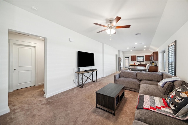 living room featuring baseboards, light carpet, visible vents, and a ceiling fan