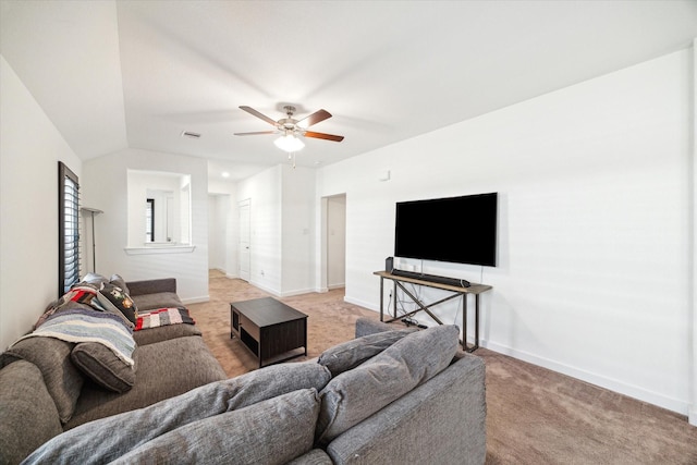 living room featuring light colored carpet, baseboards, lofted ceiling, and ceiling fan