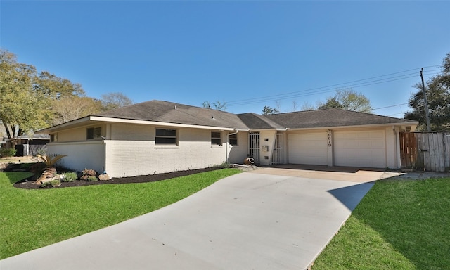 ranch-style house with a front lawn, brick siding, concrete driveway, and an attached garage