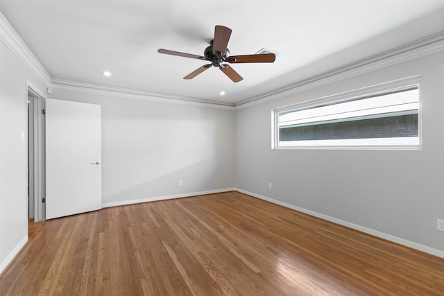 empty room with baseboards, ornamental molding, recessed lighting, wood finished floors, and a ceiling fan