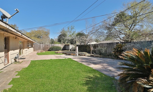 view of yard featuring a fenced backyard and a patio area