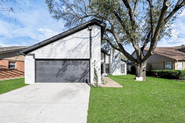 view of front facade with brick siding, a front yard, concrete driveway, and an attached garage