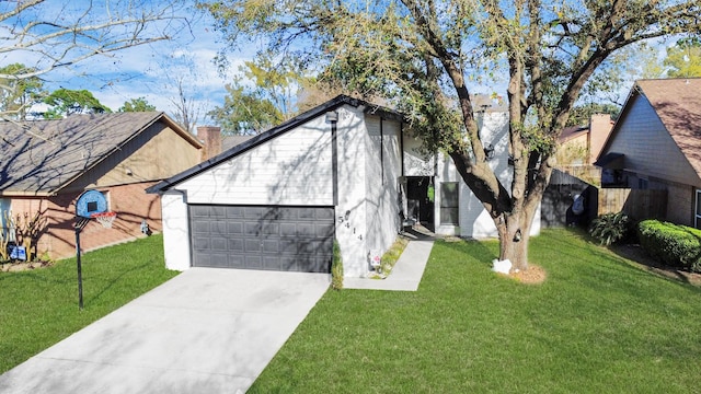 view of front of home featuring a garage, a chimney, concrete driveway, and a front yard