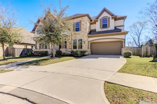 view of front of home with fence, driveway, stucco siding, stone siding, and a garage