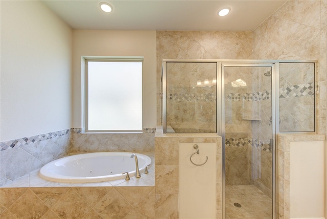 full bath featuring a tub with jets, recessed lighting, and a stall shower