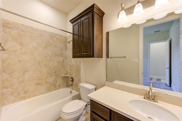 full bathroom featuring visible vents, bathing tub / shower combination, vanity, and toilet