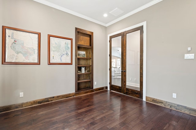 unfurnished room featuring ornamental molding, recessed lighting, french doors, baseboards, and dark wood-style flooring