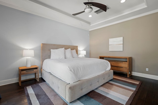 bedroom featuring recessed lighting, baseboards, a tray ceiling, and hardwood / wood-style floors