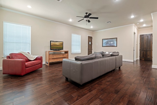 living room featuring dark wood-type flooring, a ceiling fan, baseboards, and ornamental molding