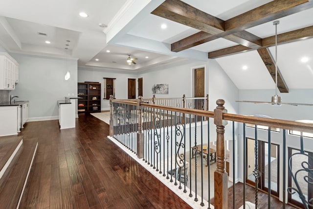 hall with recessed lighting, baseboards, beam ceiling, and dark wood finished floors