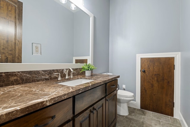 bathroom with toilet and vanity