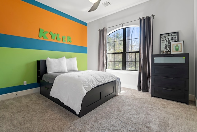 carpeted bedroom with visible vents, ceiling fan, and baseboards