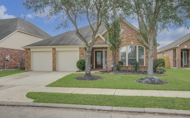 ranch-style house featuring brick siding, an attached garage, concrete driveway, and a front yard