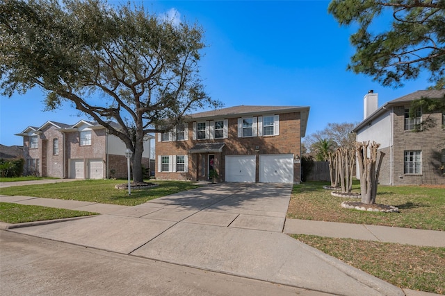 traditional-style house featuring brick siding, an attached garage, concrete driveway, and a front yard