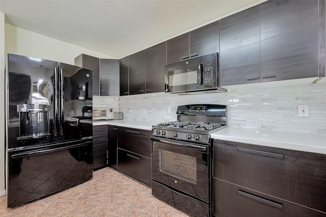 kitchen with decorative backsplash, black appliances, light countertops, and modern cabinets