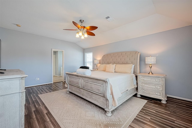 bedroom featuring a ceiling fan, dark wood-style floors, visible vents, baseboards, and vaulted ceiling