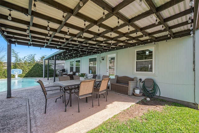 view of patio / terrace with an outdoor pool and outdoor dining area