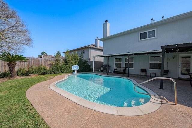 view of pool with a patio area, a fenced in pool, and a fenced backyard