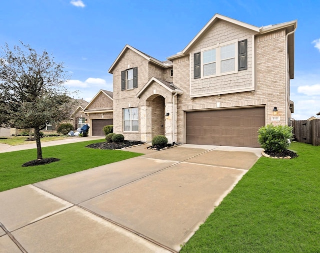 traditional-style house featuring brick siding, concrete driveway, and a front lawn