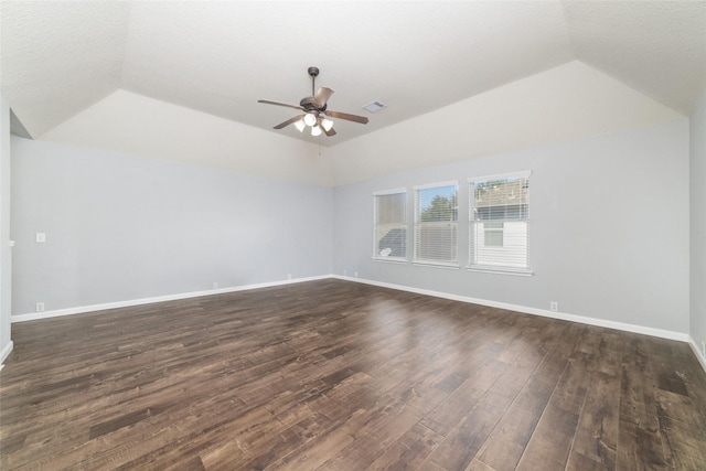 empty room with visible vents, baseboards, a ceiling fan, and vaulted ceiling