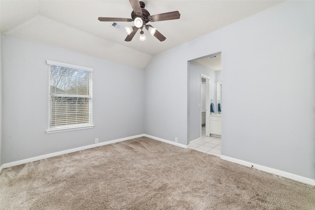 empty room with visible vents, baseboards, light colored carpet, and a ceiling fan