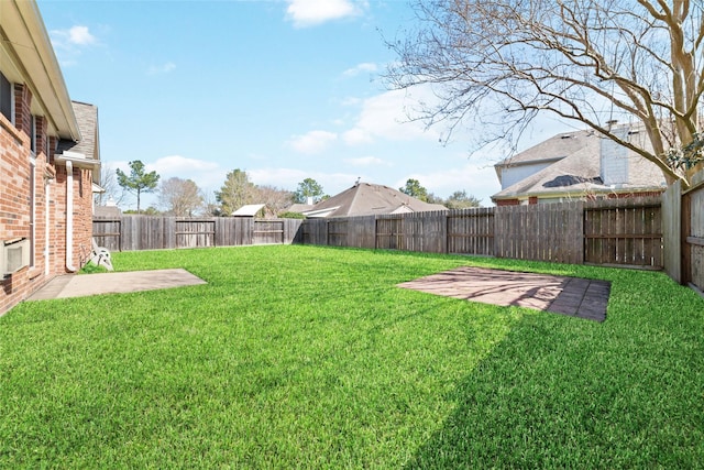 view of yard with a patio and a fenced backyard