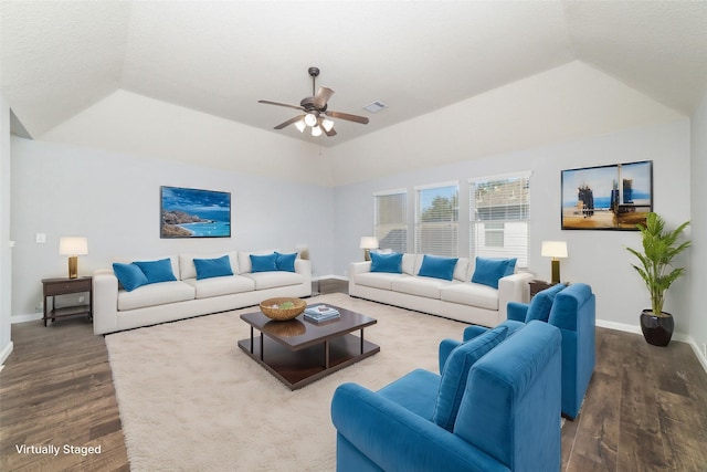 living area featuring visible vents, wood finished floors, a ceiling fan, and vaulted ceiling