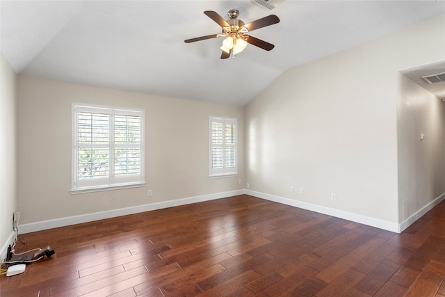 empty room featuring visible vents, ceiling fan, baseboards, lofted ceiling, and wood finished floors