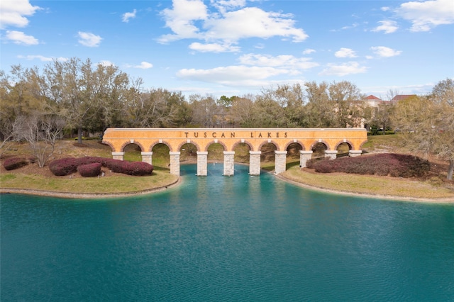 view of pool with a water view