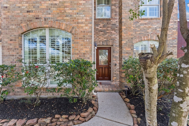 entrance to property with brick siding