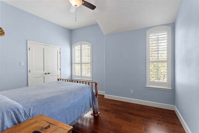 bedroom featuring hardwood / wood-style flooring, baseboards, and ceiling fan