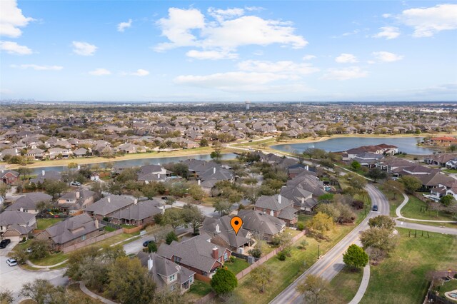 birds eye view of property featuring a residential view and a water view