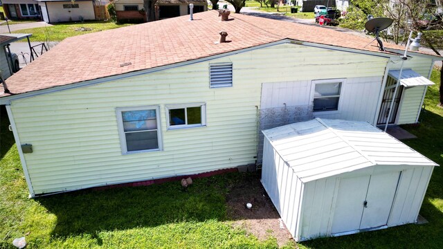 rear view of house with a lawn