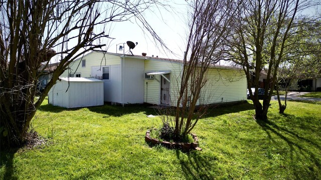 view of side of home featuring a lawn