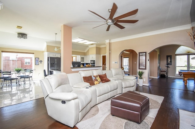 living area with pool table, crown molding, ceiling fan, dark wood-style floors, and arched walkways