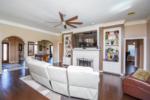 living area featuring visible vents, ceiling fan, dark wood-style floors, arched walkways, and billiards