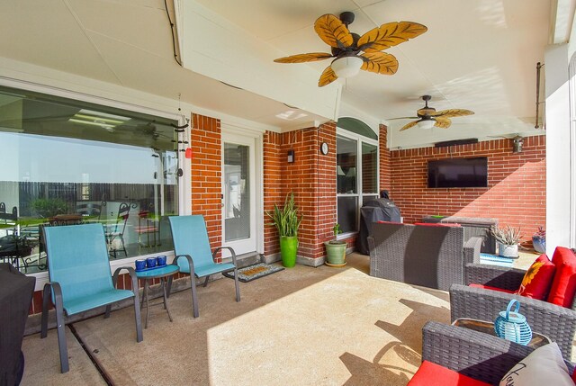 view of patio featuring ceiling fan