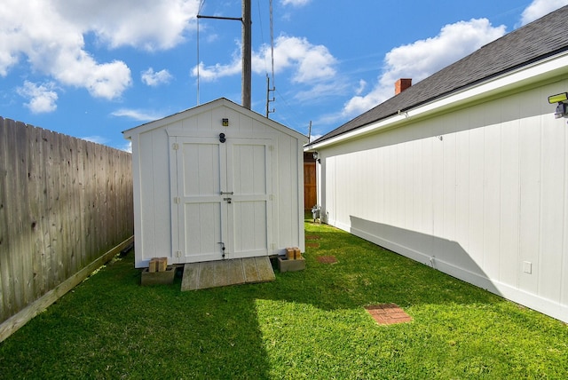 view of shed featuring a fenced backyard