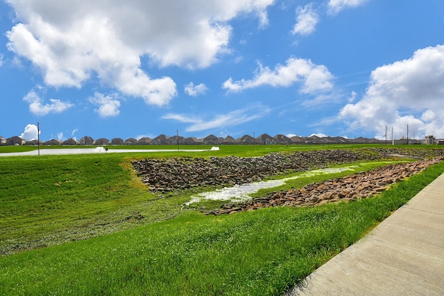 surrounding community featuring a yard