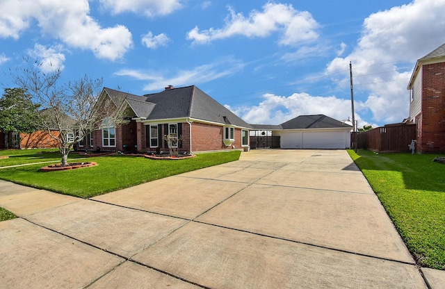 view of home's exterior featuring fence, a yard, concrete driveway, a garage, and brick siding