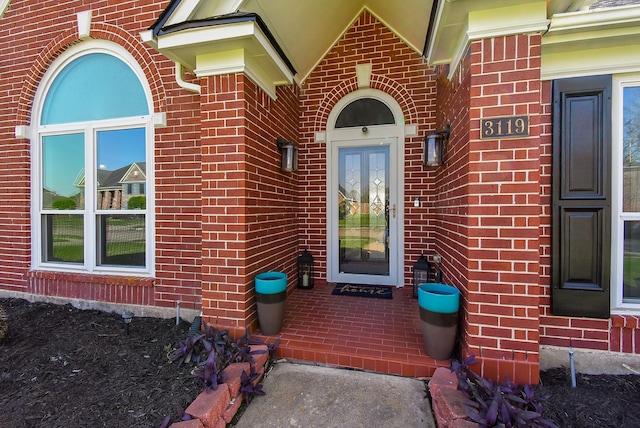 property entrance with brick siding