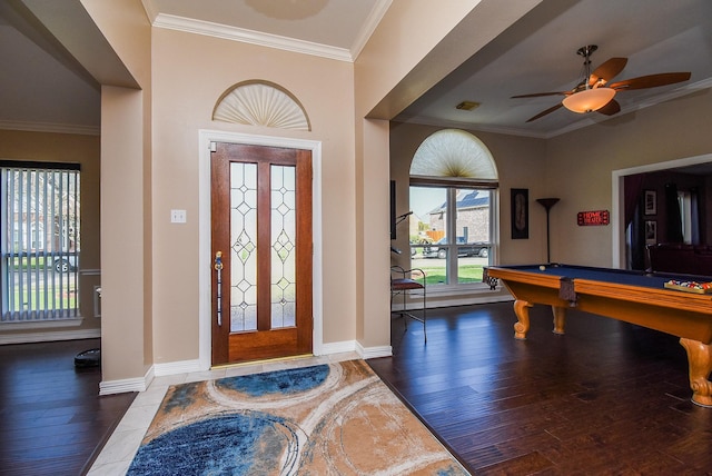 entrance foyer featuring pool table, baseboards, ceiling fan, ornamental molding, and wood finished floors