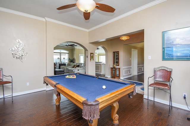 recreation room featuring arched walkways, crown molding, ceiling fan, and hardwood / wood-style flooring