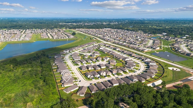 aerial view with a residential view and a water view